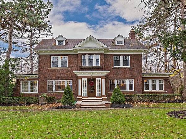 Brick 3-story house in Shaker Heights, Ohio undergoing renovation for a fix-and-flip project