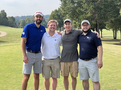 foursome at company sponsored golf tournament