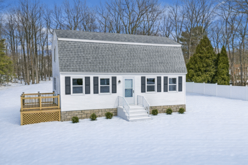 Before picture of house in snow in Derry, New Hampshire.