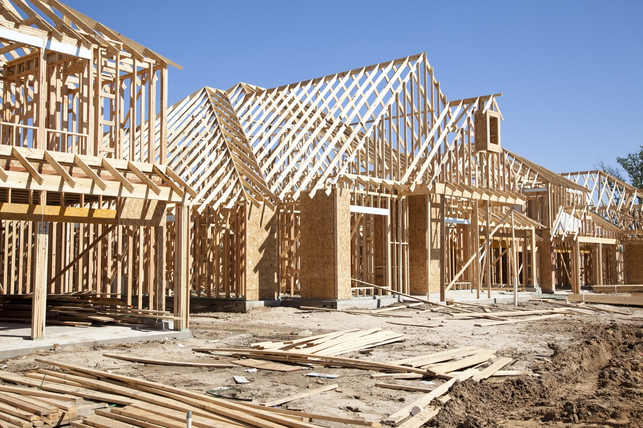 New homes construction site. Framed houses. Lumber. Building.