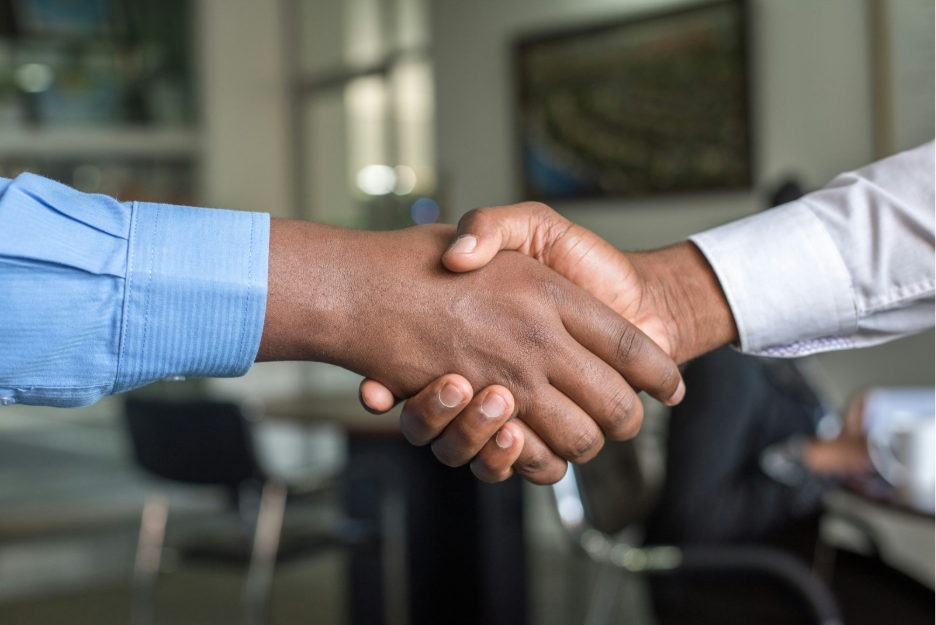 Close up of two men shaking hands 